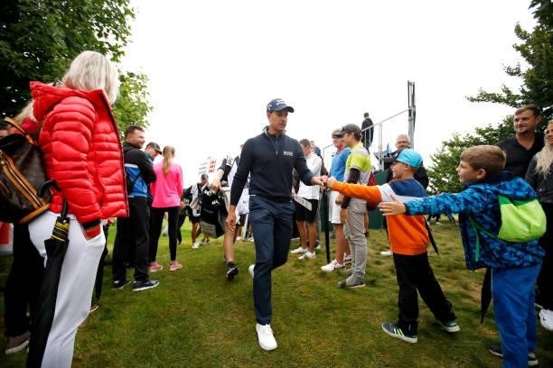 Henrik Stenson of Sweden interacts with fans as he makes his way from the ninth hole during Day Four of The D+D Real Czech Masters at Albatross Golf...