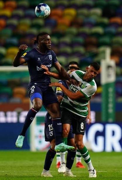 Trova Boni of Belenenses SAD with Matheus Nunes of Sporting CP in action during the Liga Bwin match between Sporting CP and Belenenses SAD at Estadio...