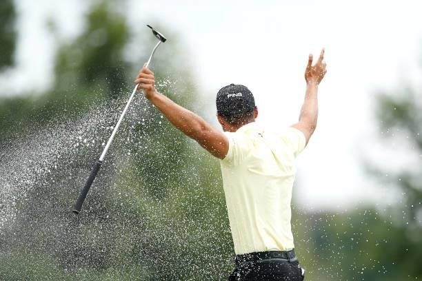 Johannes Veerman of United States is showered in champagne as he celebrates on the 18th hole after winning the D+D Real Czech Masters during Day Four...