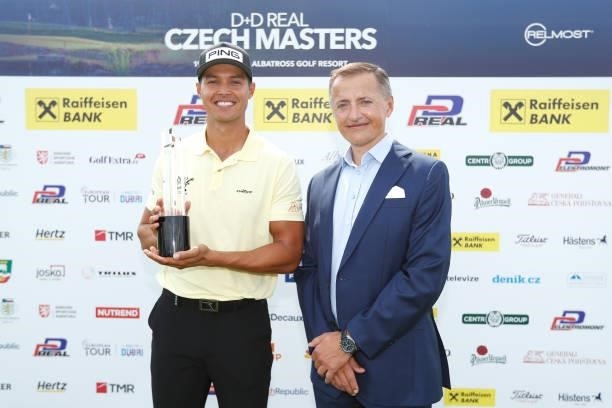 Johannes Veerman of United States poses with the trophy after winning the D+D Real Czech Masters alongside title sponsor Petr Dedek, Owner of DD...