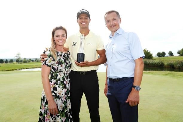 Johannes Veerman of United States poses with the trophy after winning the D+D Real Czech Masters alongside Eva Kynclova and title sponsor Petr Dedek,...