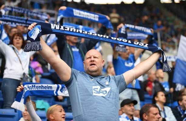 Fans raise scarves as they show their support prior to the Bundesliga match between TSG Hoffenheim and 1. FC Union Berlin at PreZero-Arena on August...
