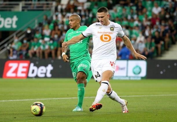 Sven Botman of Lille, Wahbi Khazri of Saint-Etienne during the Ligue 1 match between AS Saint Etienne and Lille OSC at Stade Geoffroy-Guichard on...