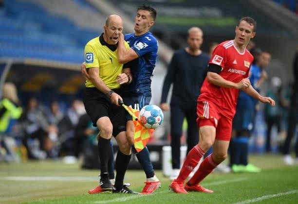 Christoph Baumgartner of TSG 1899 Hoffenheim collides with Assistant Referee, Mike Pickel during the Bundesliga match between TSG Hoffenheim and 1....