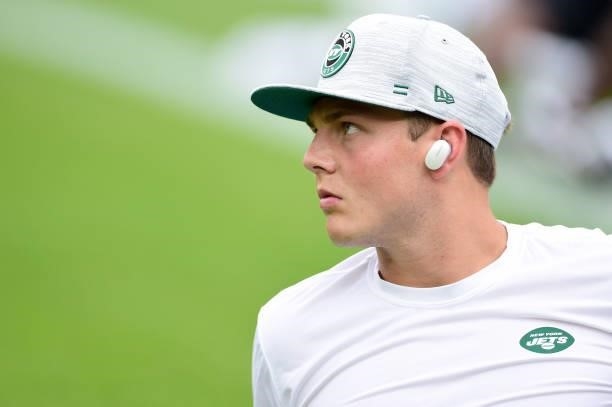 Zach Wilson of the New York Jets warms up before a preseason game against the Green Bay Packers at Lambeau Field on August 21, 2021 in Green Bay,...