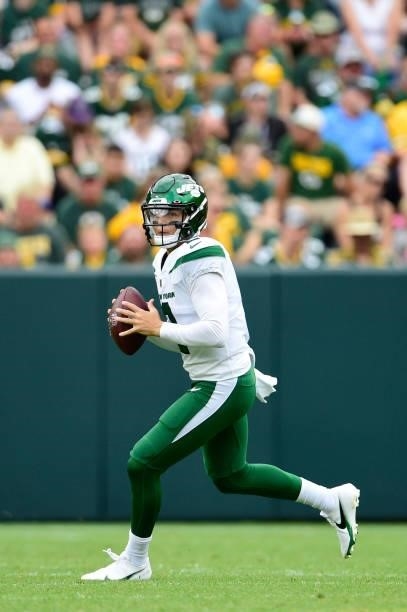 Zach Wilson of the New York Jets throws a pass against the Green Bay Packers in the first half of a preseason game at Lambeau Field on August 21,...