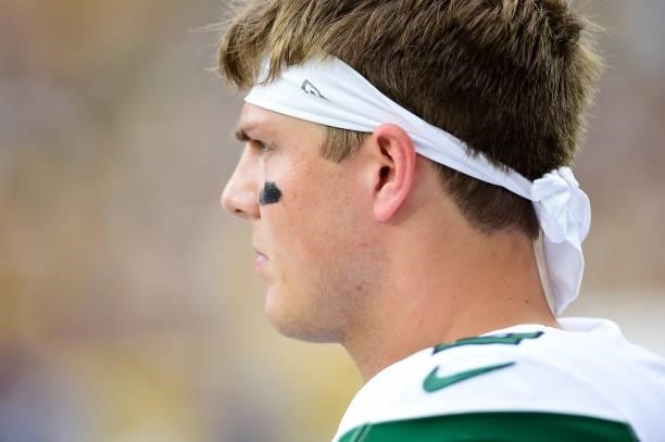 Zach Wilson of the New York Jets looks on from the sidelines against the Green Bay Packers in the first half of a preseason game at Lambeau Field on...