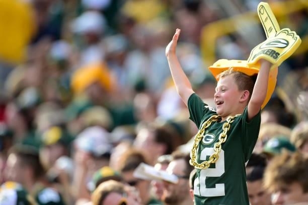 Young Green Bay Packers fan cheers in the second half of a preseason game against the New York Jets at Lambeau Field on August 21, 2021 in Green Bay,...