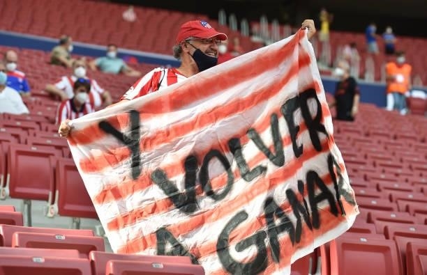 Fans display a banner as they take their seats prior to the LaLiga Santander match between Club Atletico de Madrid and Elche CF at Estadio Wanda...