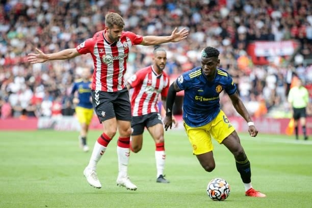 Jack Stephens of Southampton with Paul Pogba of Manchester United during the Premier League match between Southampton and Manchester United at St...