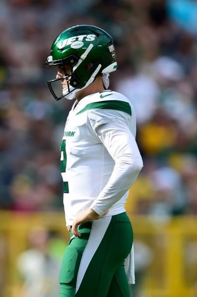 Zach Wilson of the New York Jets looks on against the Green Bay Packers in the first half of a preseason game at Lambeau Field on August 21, 2021 in...