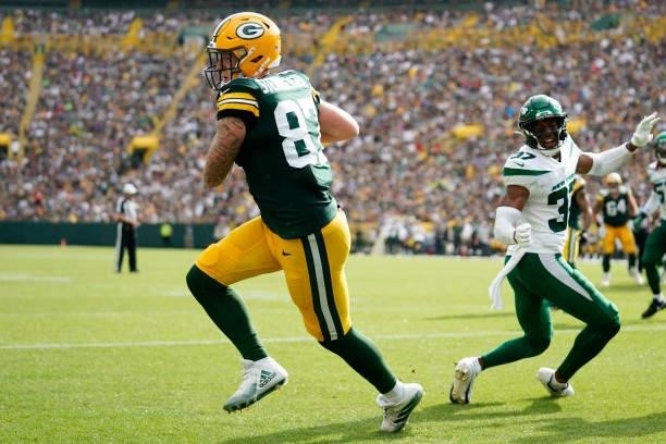 Jace Sternberger of the Green Bay Packers catches a touchdown pass against the New York Jets in the first half of a preseason game at Lambeau Field...