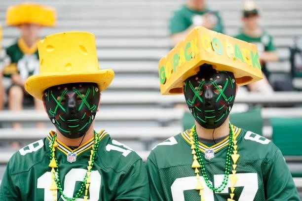 Two Green Bay Packers fans look on before a preseason game against the New York Jets at Lambeau Field on August 21, 2021 in Green Bay, Wisconsin.