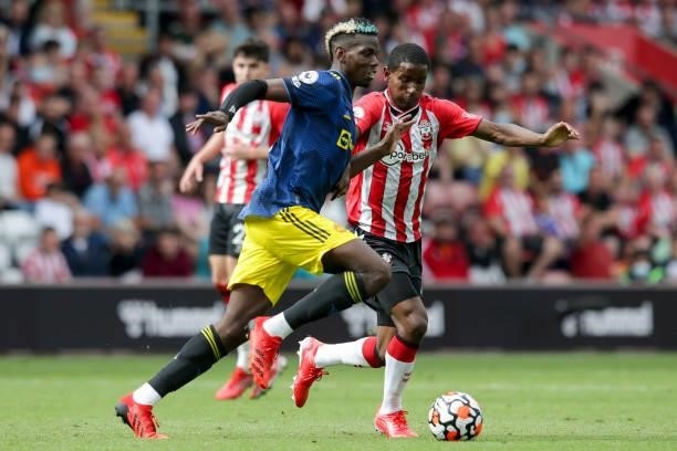 Paul Pogba of Manchester United holds off Ibrahima Diallo of Southampton during the Premier League match between Southampton and Manchester United at...