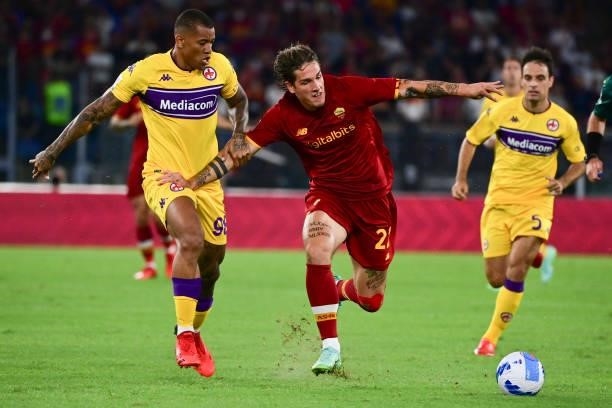 Roma player Nicolò Zaniolo competes with AFC Fiorentina players Julio Santos Igorduring the Serie A match between AS Roma and ACF Fiorentina at...