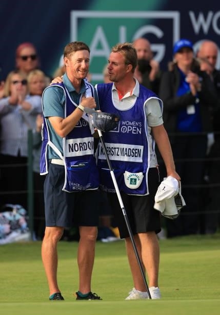 The caddies of Anna Nordqvist of Sweden and Nanna Koerstz Madsen of Denmark embrace on the eighteenth green after the final put during Day Four of...