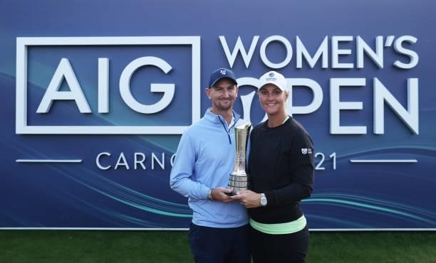 Champion, Anna Nordqvist of Sweden poses with husband, Kevin McAlpine and the AIG Women's Open trophy following Day Four of the AIG Women's Open at...