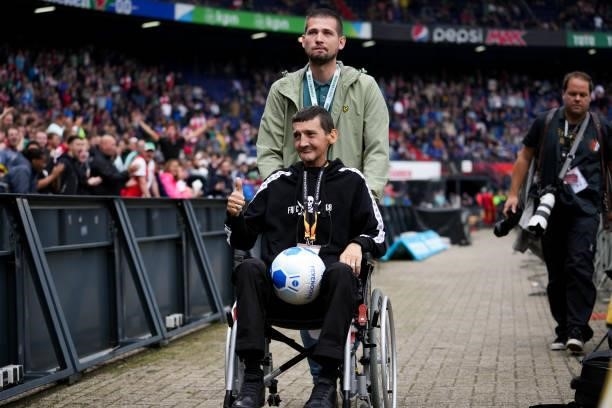 Feyenoord supporter Marco van den Wildenberg at his last game due to sickness during the Dutch Eredivisie match between Feyenoord and Go Ahead Eagles...