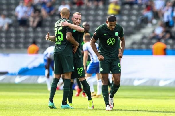 John Anthony Brooks, Maximilian Arnold of VfL Wolfsburg and Maxence Lacroix of VfL Wolfsburg react after the Bundesliga match between Hertha BSC and...
