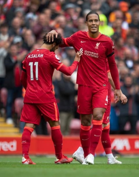 Virgil van Dijk of Liverpool congratulates team mate Mohamed Salah after he scorea but his goal is disallowed by VAR during the Premier League match...