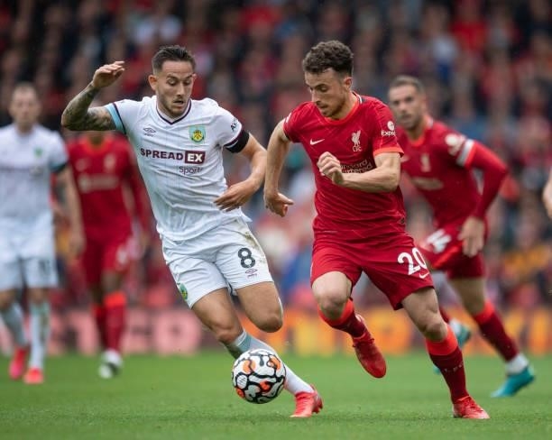 Diogo Jota of Liverpool and Josh Brownhill of Burnley in action during the Premier League match between Liverpool and Burnley at Anfield on August...