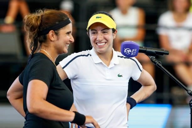 Sania Mirza of India and Christina McHale of USA laugh during an interview after winning their doubles match against Oksana Kalashnikova of Georgia...