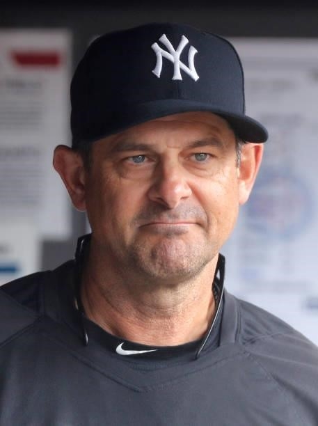 Manager Aaron Boone of the New York Yankees looks on before a game against the Minnesota Twins at Yankee Stadium on August 21, 2021 in New York City....