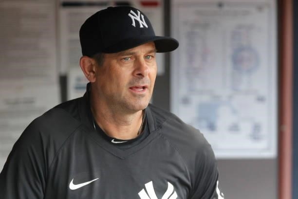 Manager Aaron Boone of the New York Yankees looks on before a game against the Minnesota Twins at Yankee Stadium on August 21, 2021 in New York City....