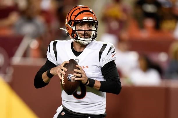 Brandon Allen of the Cincinnati Bengals drops back to pass during the NFL preseason game against the Washington Football Team at FedExField on August...
