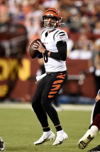 Brandon Allen of the Cincinnati Bengals drops back to pass during the NFL preseason game against the Washington Football Team at FedExField on August...