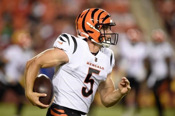 Eric Dungey of the Cincinnati Bengals runs with the ball during the NFL preseason game against the Washington Football Team at FedExField on August...