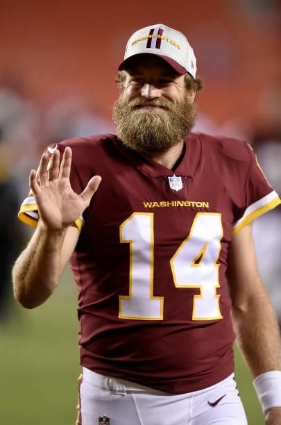 Ryan Fitzpatrick of the Washington Football Team walks off the field after the NFL preseason game against the Cincinnati Bengals at FedExField on...