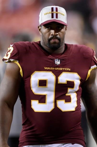 Jonathan Allen of the Washington Football Team walks off the field after the NFL preseason game against the Cincinnati Bengals at FedExField on...