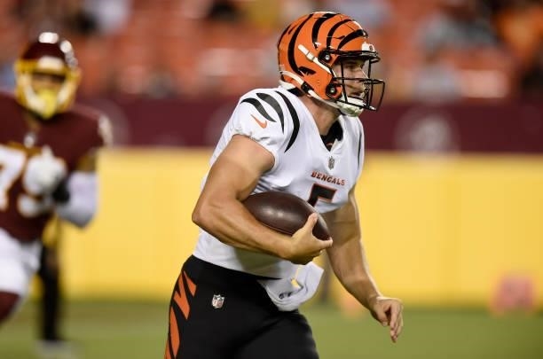 Eric Dungey of the Cincinnati Bengals runs with the ball during the NFL preseason game against the Washington Football Team at FedExField on August...