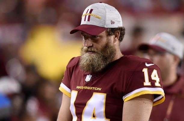 Ryan Fitzpatrick of the Washington Football Team watches during the NFL preseason game against the Cincinnati Bengals at FedExField on August 20,...