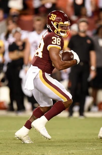 Jonathan Williams of the Washington Football Team rushes the ball during the NFL preseason game against the Cincinnati Bengals at FedExField on...