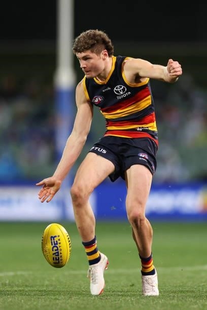 Harry Schoenberg of the Crows kicks the ball during the round 23 AFL match between Adelaide Crows and North Melbourne Kangaroos at Adelaide Oval on...