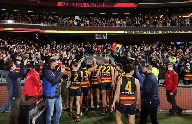 Adelaide Crows players walk from the ground during the round 23 AFL match between Adelaide Crows and North Melbourne Kangaroos at Adelaide Oval on...