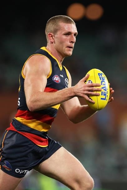 Andrew McPherson of the Crows runs with the ball during the round 23 AFL match between Adelaide Crows and North Melbourne Kangaroos at Adelaide Oval...