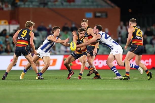 Ben Keays of the Crows handballs during the round 23 AFL match between Adelaide Crows and North Melbourne Kangaroos at Adelaide Oval on August 22,...