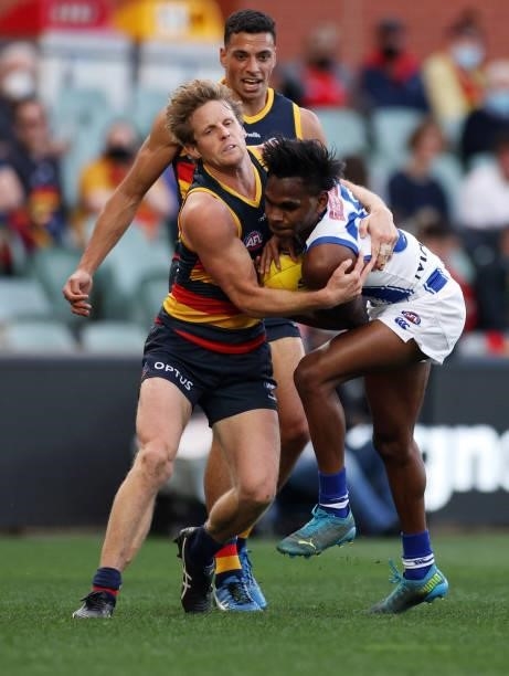 Rory Sloane of the Crows tackles Phoenix Spicer of the Kangaroos during the round 23 AFL match between Adelaide Crows and North Melbourne Kangaroos...