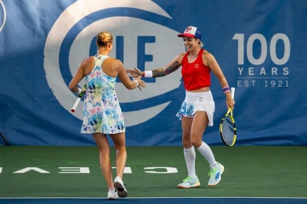 Bethanie Mattek-Sands of USA and Shelby Rogers of USA high five during their doubles match against Maria Mateas of USA and Yaroslava Shvedova of...