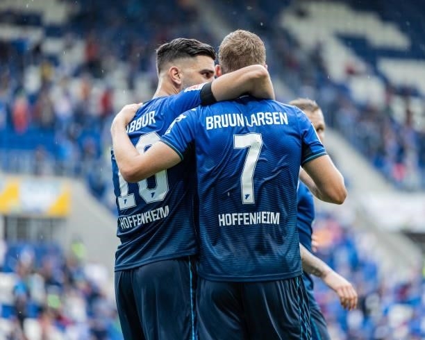 Jacob Bruun Larsen of Hoffenheim celebrates his team's second goal with team mate Munas Dabbur during the Bundesliga match between TSG Hoffenheim and...