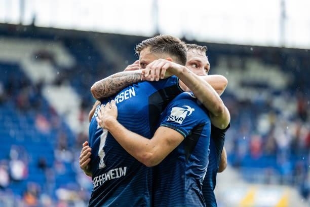 Jacob Bruun Larsen of Hoffenheim celebrates his team's second goal with team mate Christoph Baumgartner and David Raum during the Bundesliga match...