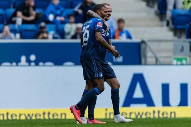 Kevin Akpoguma of Hoffenheim celebrates his team's first goal with team mate Kevin Vogt during the Bundesliga match between TSG Hoffenheim and 1. FC...