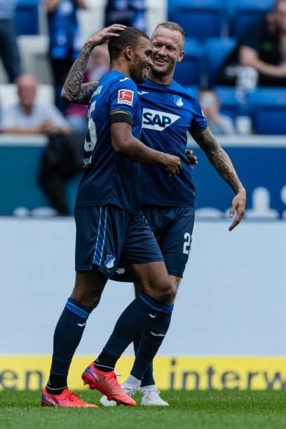 Kevin Akpoguma of Hoffenheim celebrates his team's first goal with team mate Kevin Vogt during the Bundesliga match between TSG Hoffenheim and 1. FC...