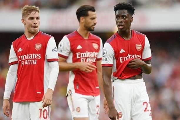 Emile Smith Rowe, Pablo Mari and Albert Sambi Lokonga of Arsenal look on during the Premier League match between Arsenal and Chelsea at Emirates...