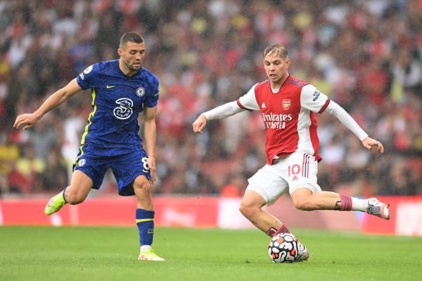 Mateo Kovacic of Chelsea and Emile Smith Rowe of Arsenal in action during the Premier League match between Arsenal and Chelsea at Emirates Stadium on...