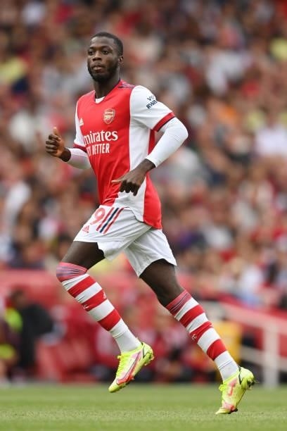 Nicolas Pepe of Arsenal in action during the Premier League match between Arsenal and Chelsea at Emirates Stadium on August 22, 2021 in London,...