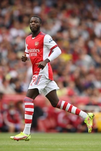 Nicolas Pepe of Arsenal in action during the Premier League match between Arsenal and Chelsea at Emirates Stadium on August 22, 2021 in London,...